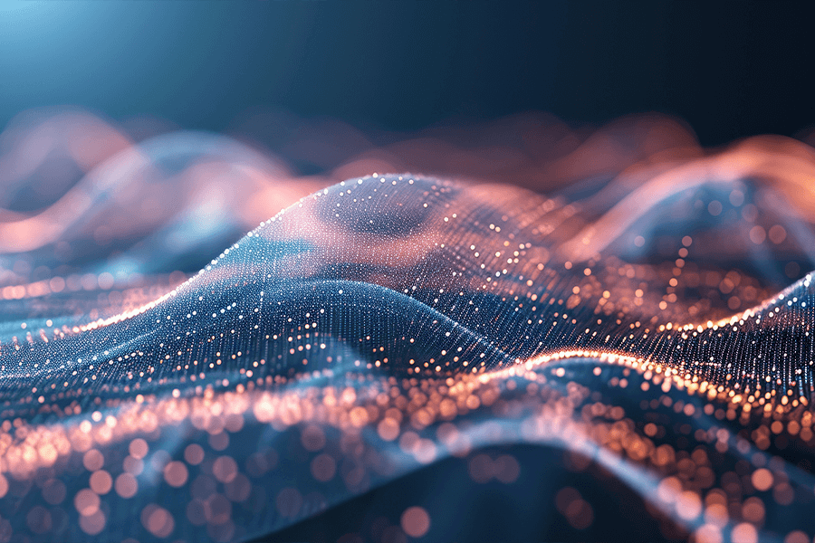 An abstract field of glowing blue and orange particles forming a wave against a dark background