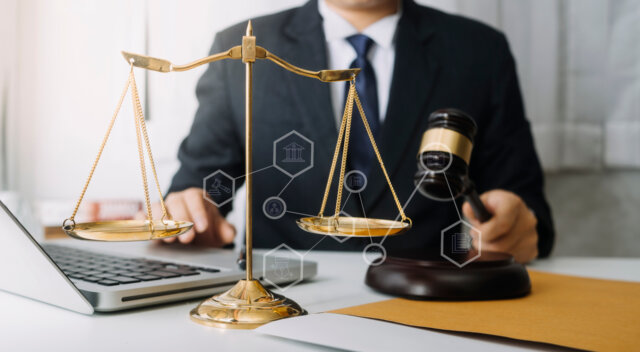 Lawyer working a lawyer working with the justice logo